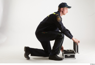 Sam Atkins Fireman Pose with Case kneeling whole body 0013.jpg